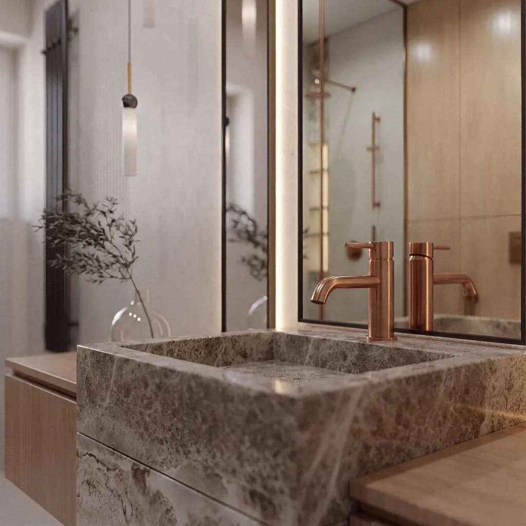 Kamienna umywalka z miedzianą baterią i podświetlanym lustrem w eleganckiej łazience – TwojeM Studio.